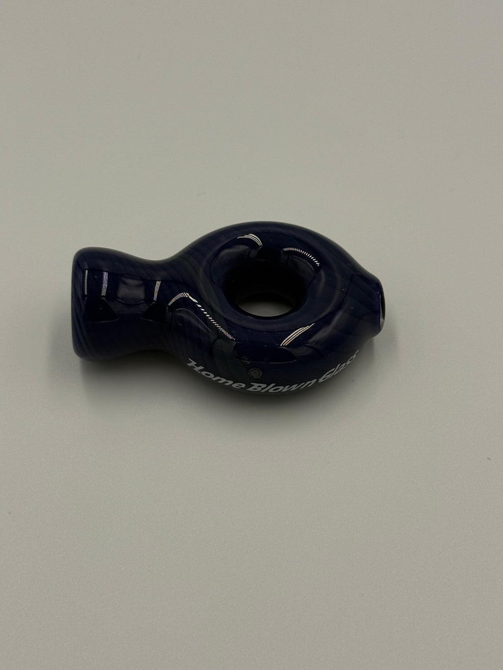 A dark navy blue Glass Pipe or handle with white printed text, shown against a plain light gray background.